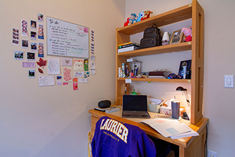 Desk and shelves filled with items