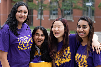 Four students smiling