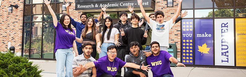 a large group of students outside of campus building